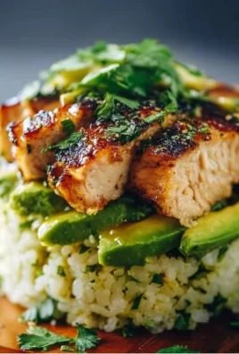 Honey Lime Chicken served with avocado rice in a meal prep stack