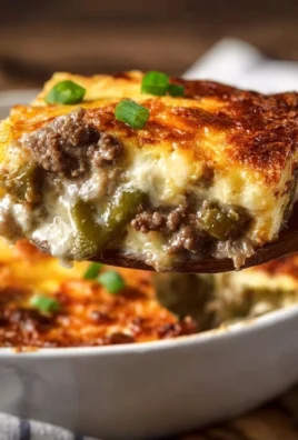 Low Carb Philly Cheesesteak Casserole with cheese and peppers in a baking dish