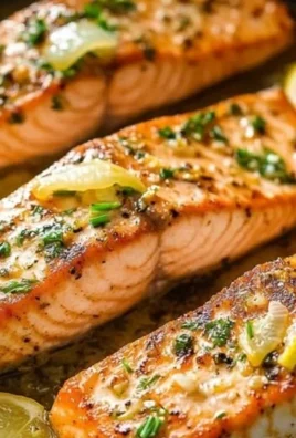 One-Pan Lemon Garlic Salmon with herbs and vegetables on a plate
