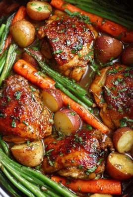 Delicious Slow Cooker Honey Garlic Chicken with fresh veggies served in a bowl.