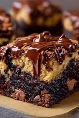 Sourdough brown butter brookies with chocolate drizzle on a rustic plate