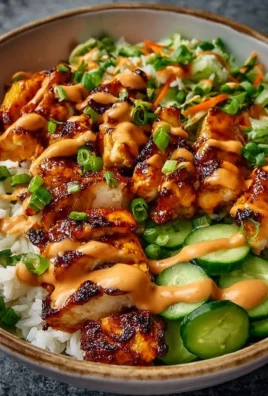 Delicious Bang Bang Chicken Bowl with colorful vegetables and creamy sauce