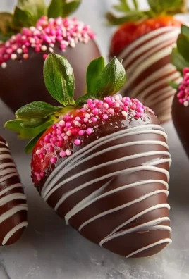 Delicious chocolate covered strawberries on a white plate