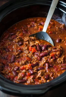 Delicious classic slow cooker chili served in a bowl with toppings
