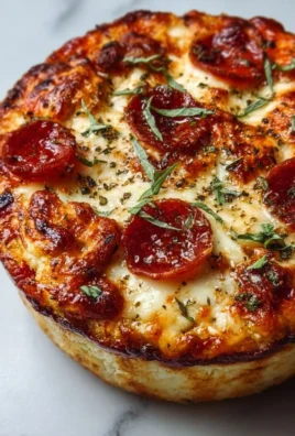 Cottage Cheese Pizza Bowl topped with fresh ingredients and herbs