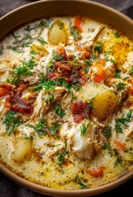 A delicious bowl of Crack Chicken Soup garnished with herbs and served warm.