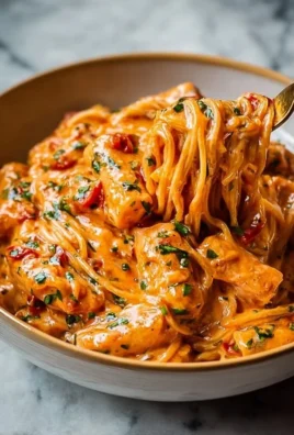 Creamy tomato garlic pasta garnished with fresh basil
