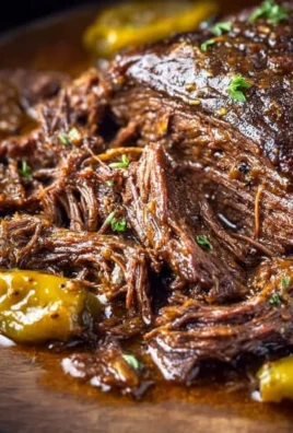 Delicious Crockpot Mississippi Pot Roast served with seasoning and vegetables.