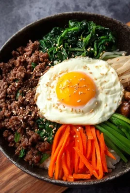 Delicious Easy Bibimbap served in a bowl with colorful vegetables and egg