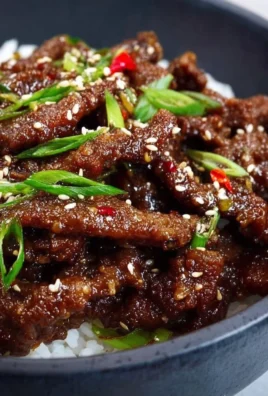 Delicious Easy Mongolian Beef served with steamed rice and vegetables.