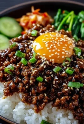 Delicious Korean Ground Beef Bowl topped with fresh vegetables and garnishes.