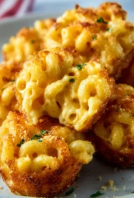 Mini macaroni and cheese bites served on a platter
