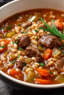 Bowl of hearty beef barley soup inspired by the Pioneer Woman recipe