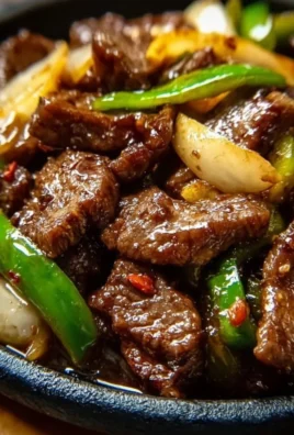 Sizzling Chinese pepper steak with onions served in a bowl