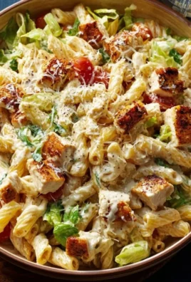 Delicious creamy chicken pasta served in a bowl garnished with herbs