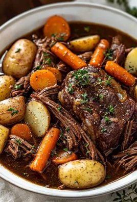 Delicious and tender Crock Pot pot roast ready to serve with vegetables