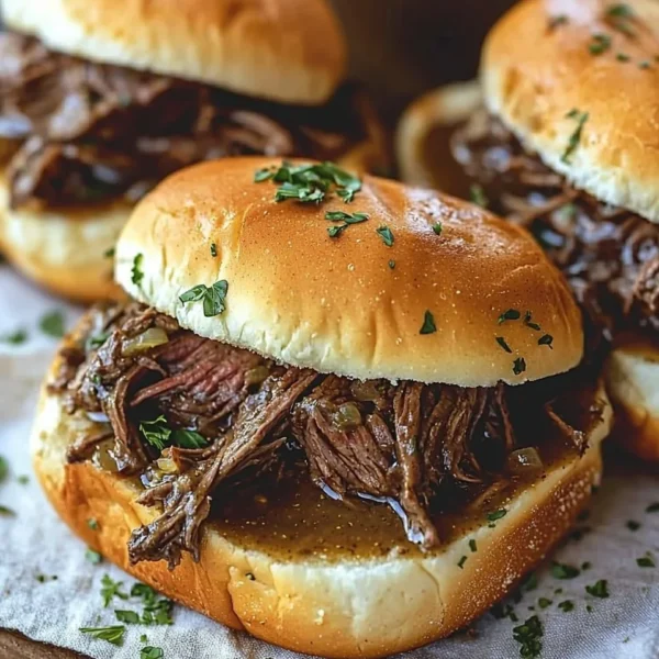 Delicious Crockpot French Dip Sandwiches with beef and cheese ready to serve.