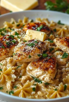 Garlic Butter Chicken served with bowtie pasta in a creamy sauce