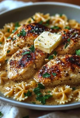 Delicious Garlic Butter Chicken served with Bowtie Pasta on a plate.