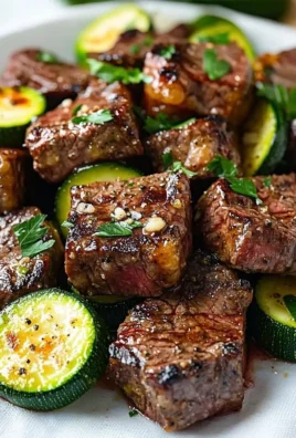 Plate of Garlic Butter Steak Bites topped with fresh herbs