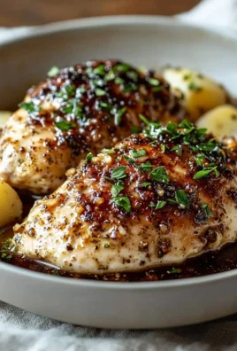 Delicious Garlic Herb Chicken served with fresh herbs and spices.