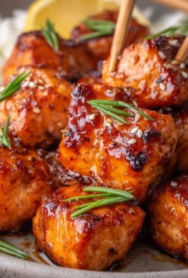 Delicious honey garlic salmon bites garnished with green onions