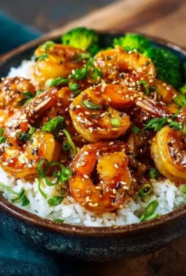 Delicious Honey Garlic Shrimp Bowls garnished with fresh vegetables