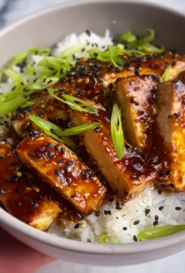 Delicious Honey Garlic Tofu served with vegetables and rice