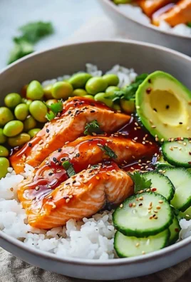 Delicious Honey Sriracha Salmon bowls with fresh vegetables and rice