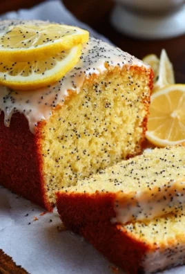 Deliciously moist Lemon Poppy Seed Cake topped with lemon glaze.