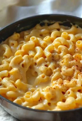 One pot creamy mac and cheese ready to serve on a stovetop