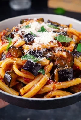 Delicious Pasta in the Style of Norma served with fresh ingredients.