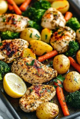 Sheet pan with lemon herb chicken and colorful roasted vegetables