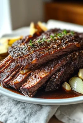 Slow cooked beef brisket served with rich gravy and sides