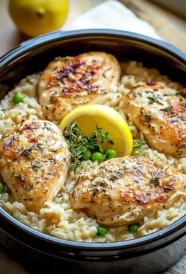 Slow Cooker Lemon Herb Chicken served with rice in a bowl