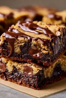Sourdough brown butter brookies topped with chocolate drizzle on a plate